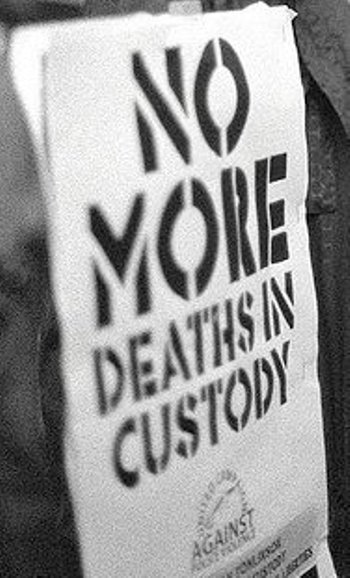 No More Deaths in Custody placard